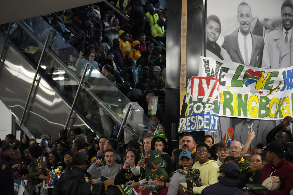 Fans welcome South Africa' Springbok team as they arrive at O.R Tambo's international airport in Johannesburg, South Africa, Tuesday Oct. 31, 2023, after the Rugby World Cup. (AP Photo/Themba Hadebe)
