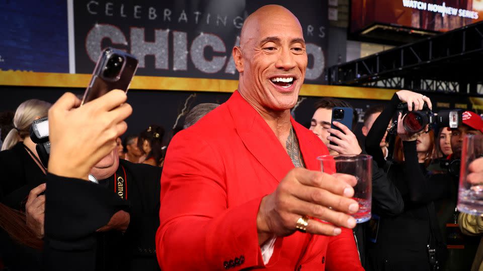 Dwayne Johnson raises a glass of his Teremana Tequila in a 2022 photo. - Mike Segar/Reuters