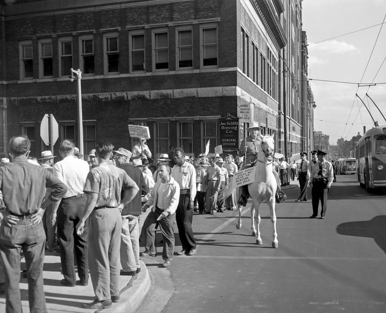 About 1,000 picketers, including some on horseback, march outside the Schlitz Brewery on West Galena Street on July 24, 1953. This photo ran on the front page of that day's Milwaukee Journal.