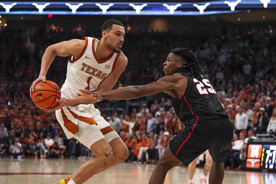 Texas forward Dylan Disu, left, tries to get by Houston forward Joseph Tugler during Houston's 76-72 overtime win Monday at Moody Center. The Longhorns shook off a slow start to force the extra period, but Houston's rebounding and overtime defense helped the No. 4 Cougars survive for a road win.