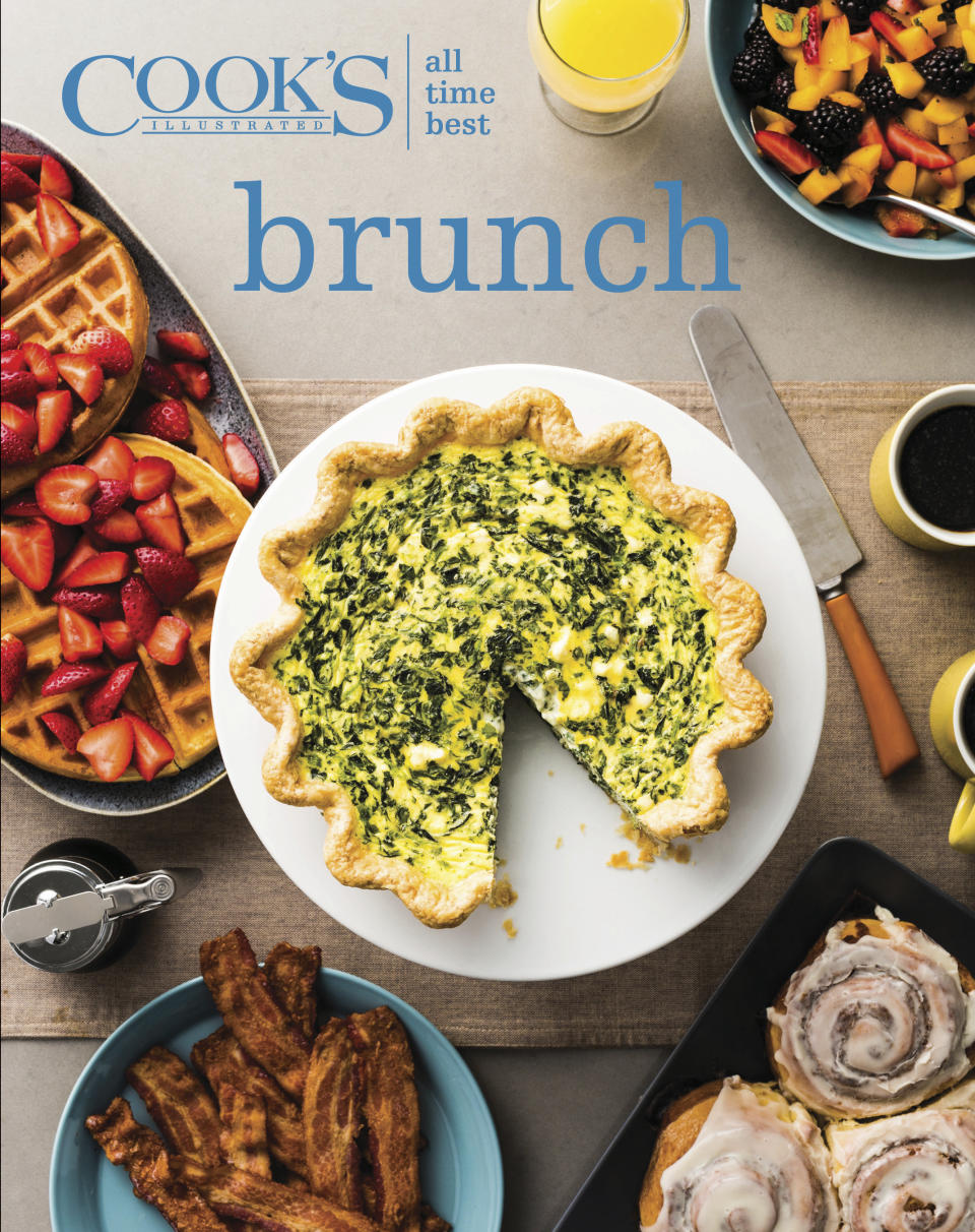 This image provided by America's Test Kitchen in October 2018 shows the cover for the cookbook “ATB Brunch.” It includes a recipe for a leek and goat cheese quiche and a cider-glazed apple bundt cake. (America's Test Kitchen via AP)