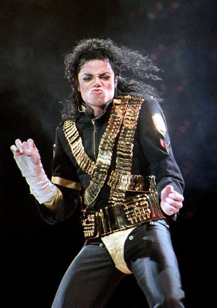 (FILES) In this file photo taken on August 28, 1993 Pop star Michael Jackson performs the first of two concerts at the National Stadium in Singapore. - A new documentary that accuses Michael Jackson of sexually abusing two boys has been denounced by the late pop star's estate as an "outrageous and pathetic" attempt to exploit his name."Leaving Neverland," which is to premiere at the Sundance Film Festival later this month, recounts the story of two men who are now in their 30s and allege they were sexually abused by the King of Pop when they were seven and 10. (Photo by Roslan RAHMAN / AFP)        (Photo credit should read ROSLAN RAHMAN/AFP/Getty Images)