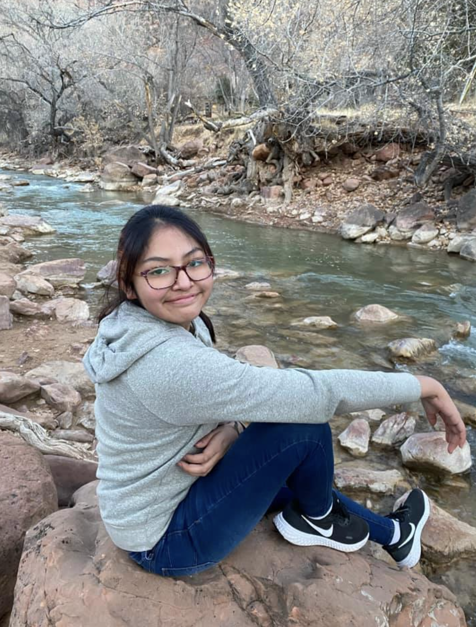 Lyssa Rose Upshaw is seen near a stream.