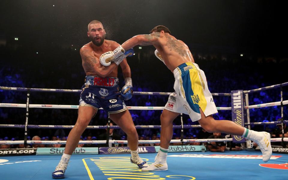 Tony Bellew (left) in action against Oleksandr Usyk during their WBC, WBA, IBF, WBO & Ring Magazine Cruiserweight World Championship bout at Manchester Arena