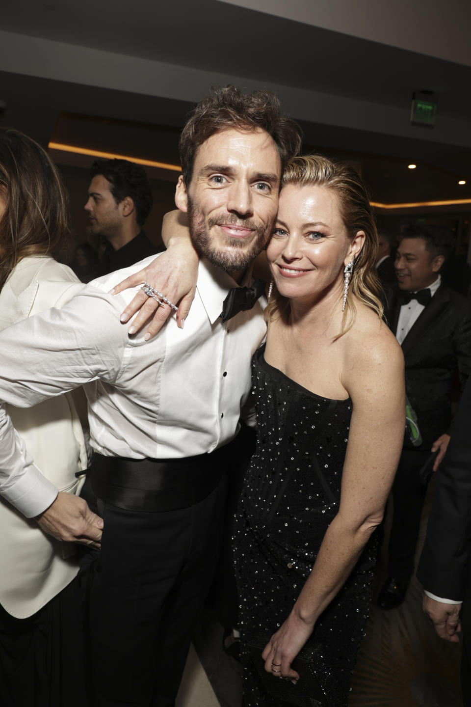 Closeup of Sam Claflin and Elizabeth Banks