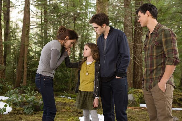 <p>Andrew Cooper/Summit Entertainment</p> Kristen Stewart, Mackenzie Foy, Robert Pattinson and Taylor Lautner in 'The Twilight Saga: Breaking Dawn Part 2'.'.