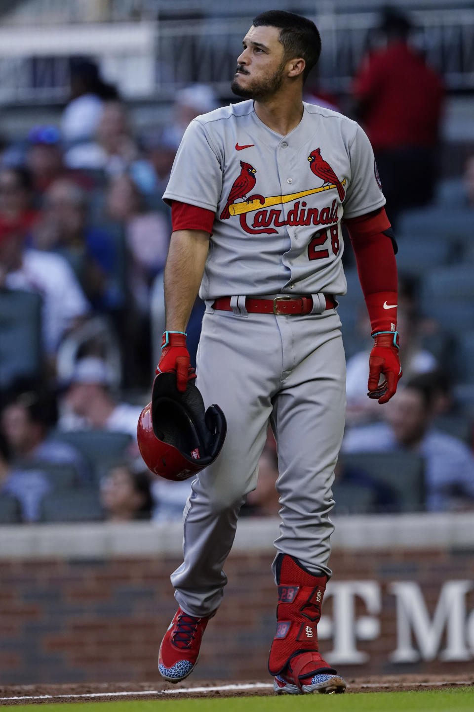 St. Louis Cardinals' Nolan Arenado walks back to the dugout after striking out to end the Cardinals' half of the fourth inning of a baseball game against the Atlanta Braves on Thursday, June 17, 2021, in Atlanta. (AP Photo/John Bazemore)