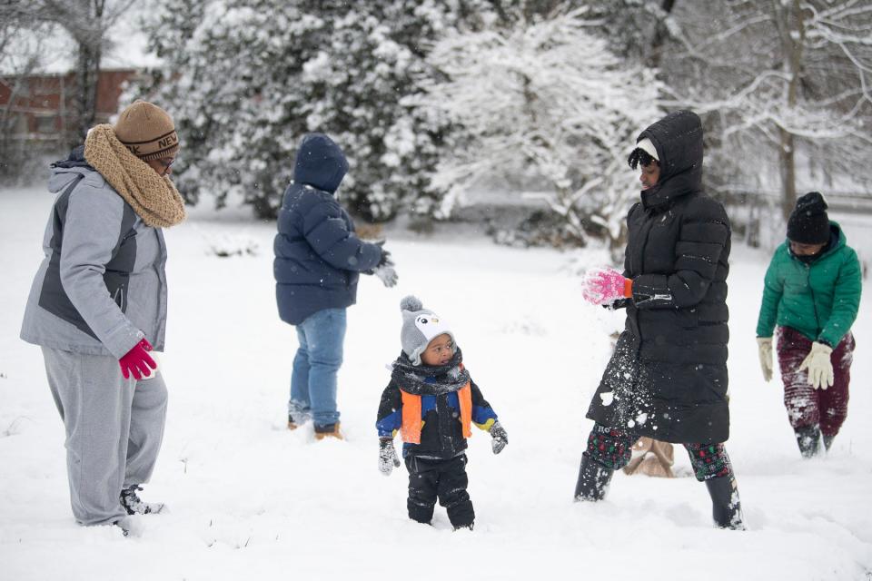 Knoxville's most recent white Christmas was in 2020. The Moulden family spent part of that day playing in the snow. "He loves being outside," said Katrina Moulden, left, of her one-year-old son Xavier, 1, who was playing in snow for the first time.