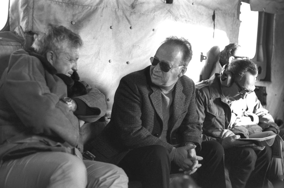 <p>Security Advisor Ariel Sharon (L) confers with Israeli Prime Minister Yitzhak Rabin (C) during a flight on a military helicopter in this December 11, 1975. To the right is Israeli Defence Minister Shimon Peres. (REUTERS/Yaacov Saar/GPO) </p>