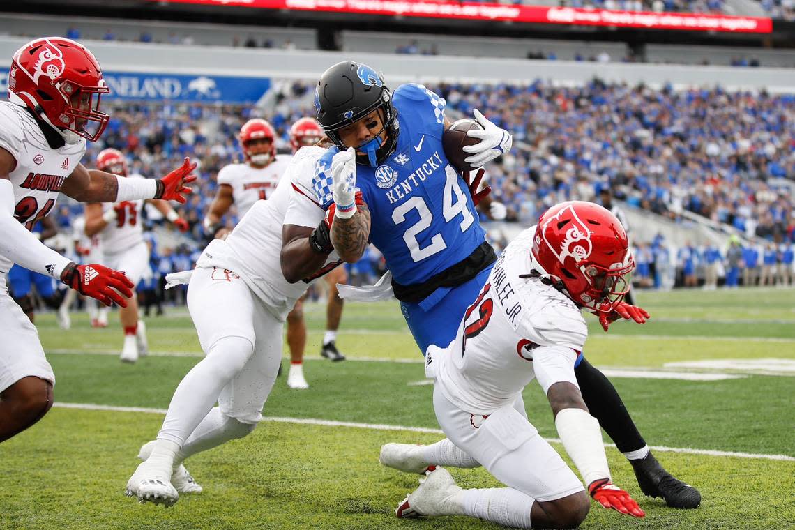 Kentucky’s Christopher Rodriguez carries the ball against Louisville on Saturday, Nov. 26, 2022, at Kroger Field in Lexington, Kentucky.