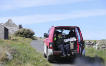 Ballot boxes are transported around Inishbofin island, Ireland, Thursday, May 23, 2019 in preparation for voting in the European Parliament elections. Some 400 million Europeans from 28 countries head to the polls from Thursday to Sunday to choose their representatives at the European Parliament for the next five years. (Niall Carson/PA via AP)