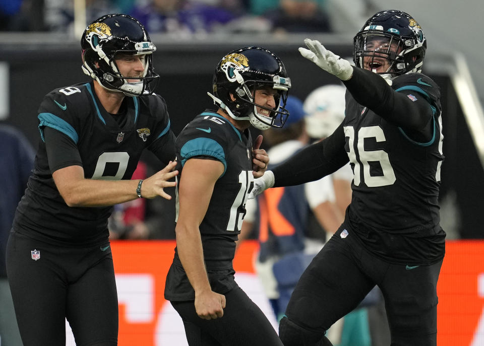 Jacksonville Jaguars kicker Matthew Wright (15), center, celebrates after kicking a field goal to win the match during the second half of an NFL football game between the Miami Dolphins and the Jacksonville Jaguars at the Tottenham Hotspur stadium in London, England, Sunday, Oct. 17, 2021. (AP Photo/Matt Dunham)