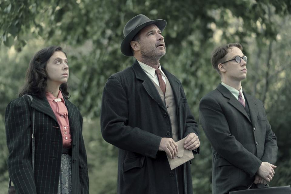 <div class="inline-image__caption"><p>Miep Gies, played by Bel Powley, Otto Frank, played by Liev Schreiber, and Jan Gies, played by Joe Cole, look up at Otto’s old apartment as seen in <em>A Small Light</em>.</p></div> <div class="inline-image__credit">National Geographic for Disney/Dusan Martincek</div>