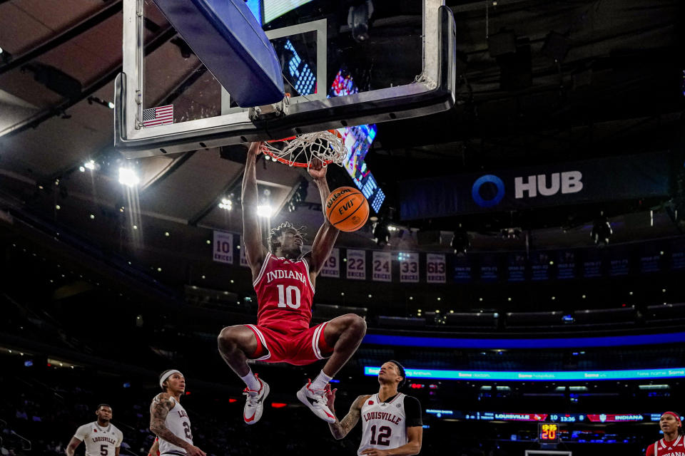 Indiana forward Kaleb Banks (10) dunks the ball in an NCAA college basketball game against Louisville in the Empire Classic tournament in New York, Monday, Nov. 20, 2023. (AP Photo/Peter K. Afriyie)