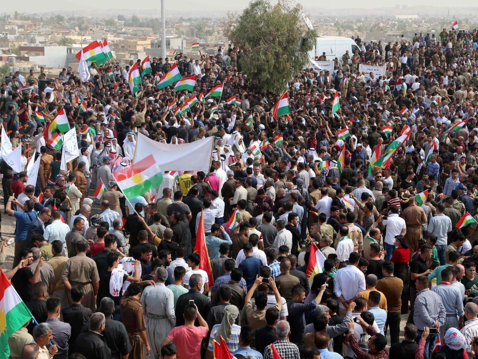 Iraqis wave Kurdish flags as they gather in support of the upcoming independence referendum in Kirkuk next week: AFP/Getty