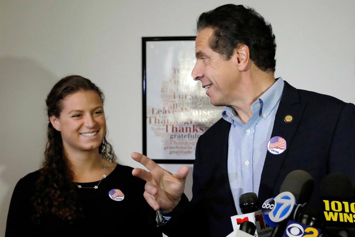FILE - New York Gov. Andrew Cuomo refers to his daughter, Cara Kennedy-Cuomo, left, as he comments after voting at the Presbyterian Church of Mount Kisco, in Mt. Kisco, N.Y., on Nov. 6, 2018. A New York state trooper romantically involved with one of then-Gov. Andrew Cuomo's daughters while he served on the governor's security detail should have been disciplined, according to an inspector general's report, released Friday, Aug. 19, 2022. The report is critical of how state police handled the matter. 