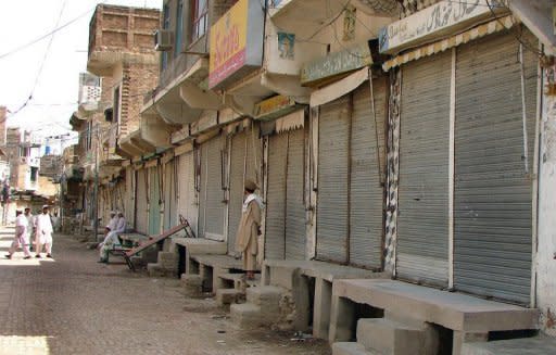 This file photo shows Pakistani shopkeepers standing outside closed market stalls in Miranshah, the main town in the troubled North Waziristan tribal district, in 2007. A US drone strike on a militant compound killed five insurgents in Miranshah early Thursday, according to officials