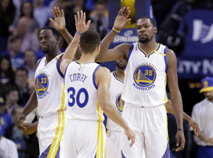 Stephen Curry chooses his high-five wisely. (AP Photo/ Marcio Jose Sanchez)