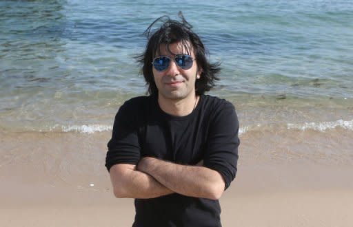 German director Fatih Akin poses during a photo session to promote his movie "Polluting Paradise" at the 65th Cannes film festival on May 17. Akin, who lives in Hamburg, stumbled upon the scandal of a garbage landfill built just above his ancestral village in Turkey while filming "The Edge of Heaven", for which he snagged the Cannes screenplay prize in 2007