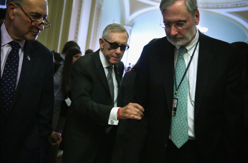 Dauster (right) remembers the day Reid (center) decided he would have to get rid of the filibuster for judicial nominations and Cabinet appointments. (Photo: Alex Wong via Getty Images)