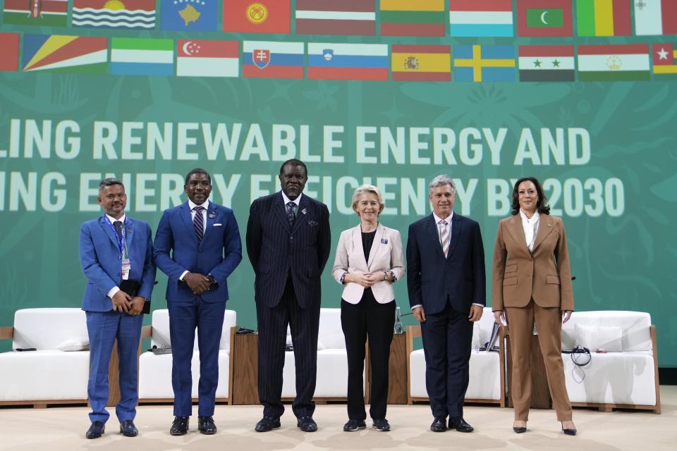 Vanuatu Deputy Prime Minister Matai Seremaiah, from left, Terrance Drew, prime minister of St. Kitts and Nevis, Namibia President Hage Geingob, European Commission President Ursula von der Leyen, Paulo Teixeira, Brazil's Minister of Agricultural Development, and Vice President Kamala Harris pose for photos at the COP28 U.N. Climate Summit, Saturday, Dec. 2, 2023, in Dubai, United Arab Emirates. (AP Photo/Kamran Jebreili)