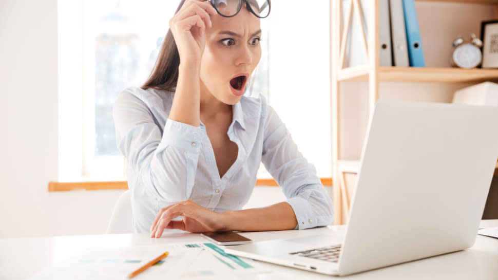  shocked woman at laptop 