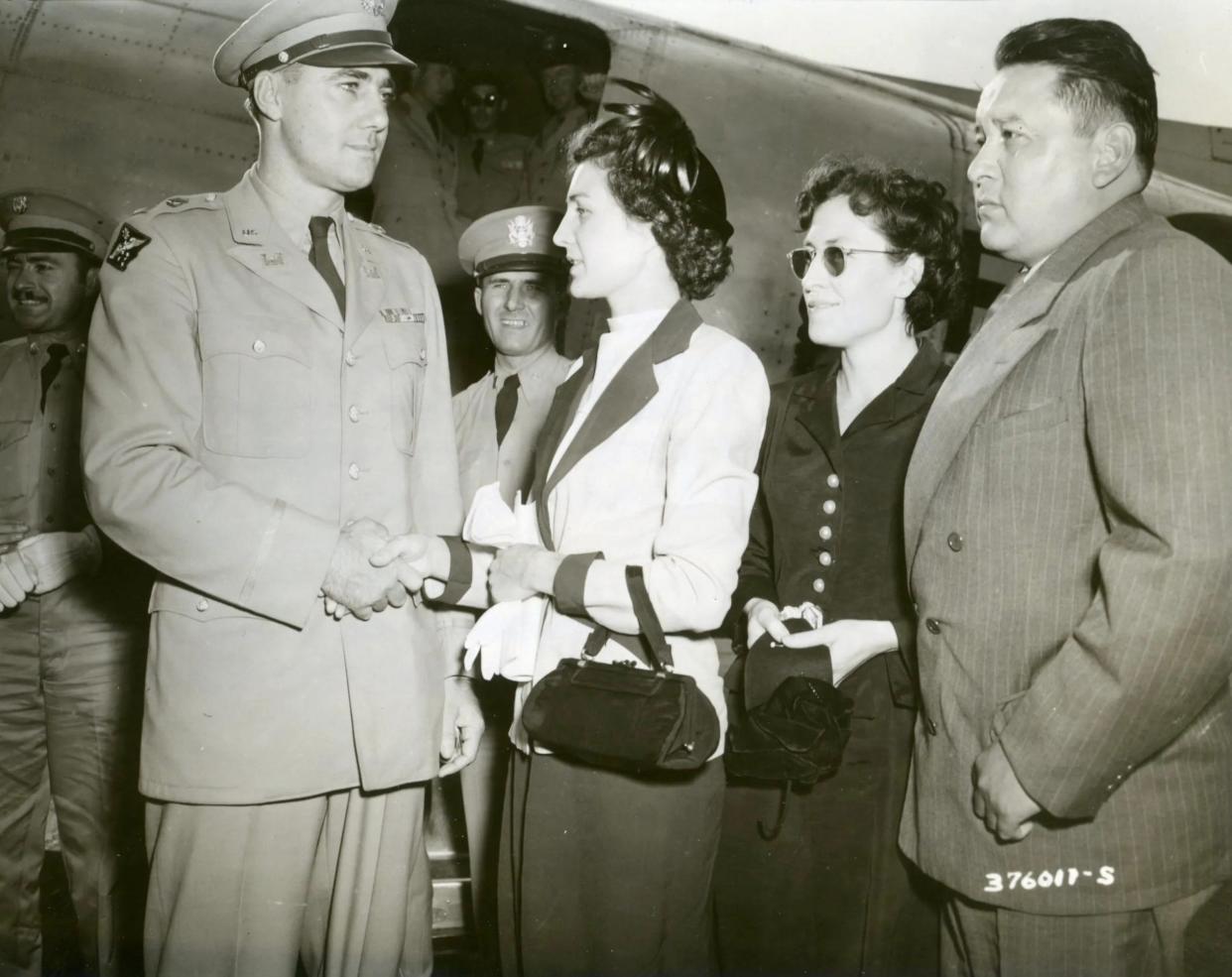 Evelyn Rice, Thelma Rice and Henry Rice are greeted as they arrive in Washington, D.C. on Sept. 4, 1951.