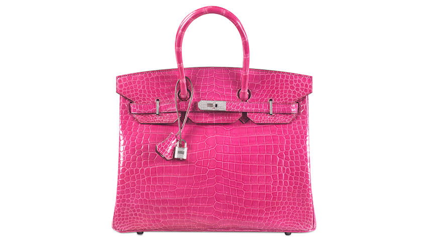 </a> The crocodile-skin Hermes Birkin bag broke the record for the most expensive handbag sold at auction, selling for $222,912 at a Christie's auction in Hong Kong.Courtesy of Christie's