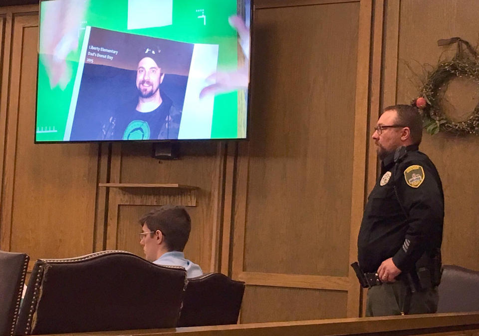 FILE - In this Sept. 5, 2016, file photo, John A. Radavich, 24, left, awaits the start of his first-degree murder trial in Spokane County Superior Court in Spokane, Wash. The discovery of new evidence was what prompted a judge to declare a mistrial in the prosecution of Radavich, who is charged with killing the nephew of U.S. Sen. Jon Tester of Montana in a sword attack. The Spokesman-Review in Spokane reported Friday, April 19 2019, that court records show a sheriff's detective found a text message in the case file while preparing to give testimony that hadn't been turned over to the defense. (Thomas Clouse/The Spokesman-Review via AP, File)