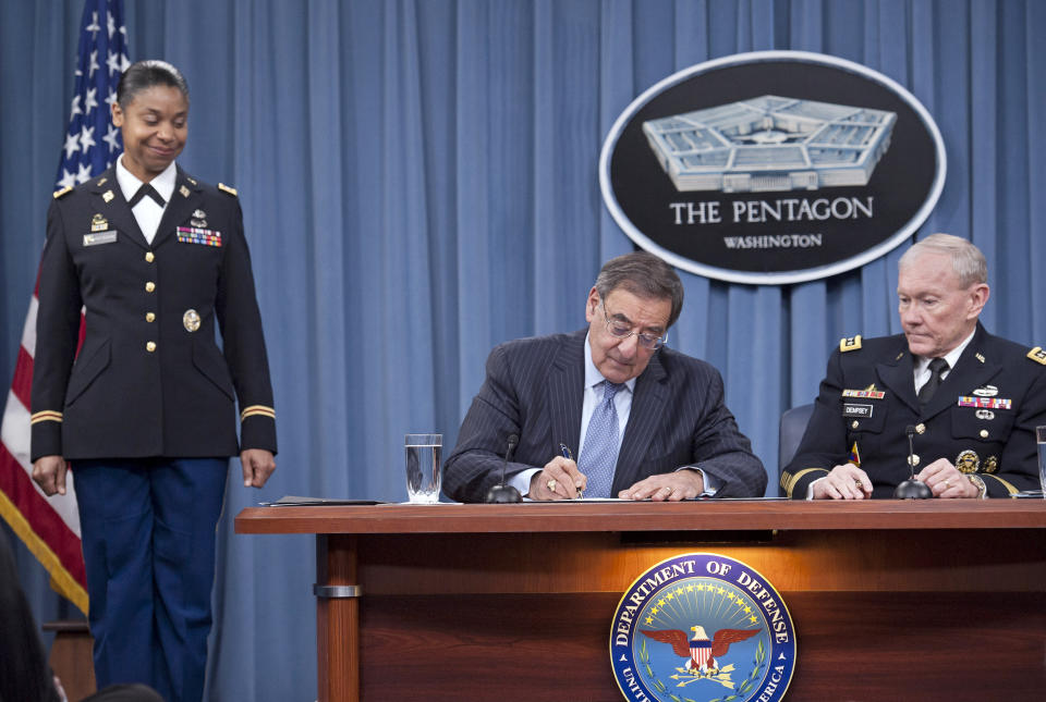 Defense Secretary Leon Panetta, with Joint Chiefs Chairman Gen. Martin Dempsey, right, and Army Lt. Col. Tamatha Patterson