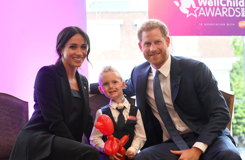 Meghan and Harry with McKenzie Brackley (REUTERS)