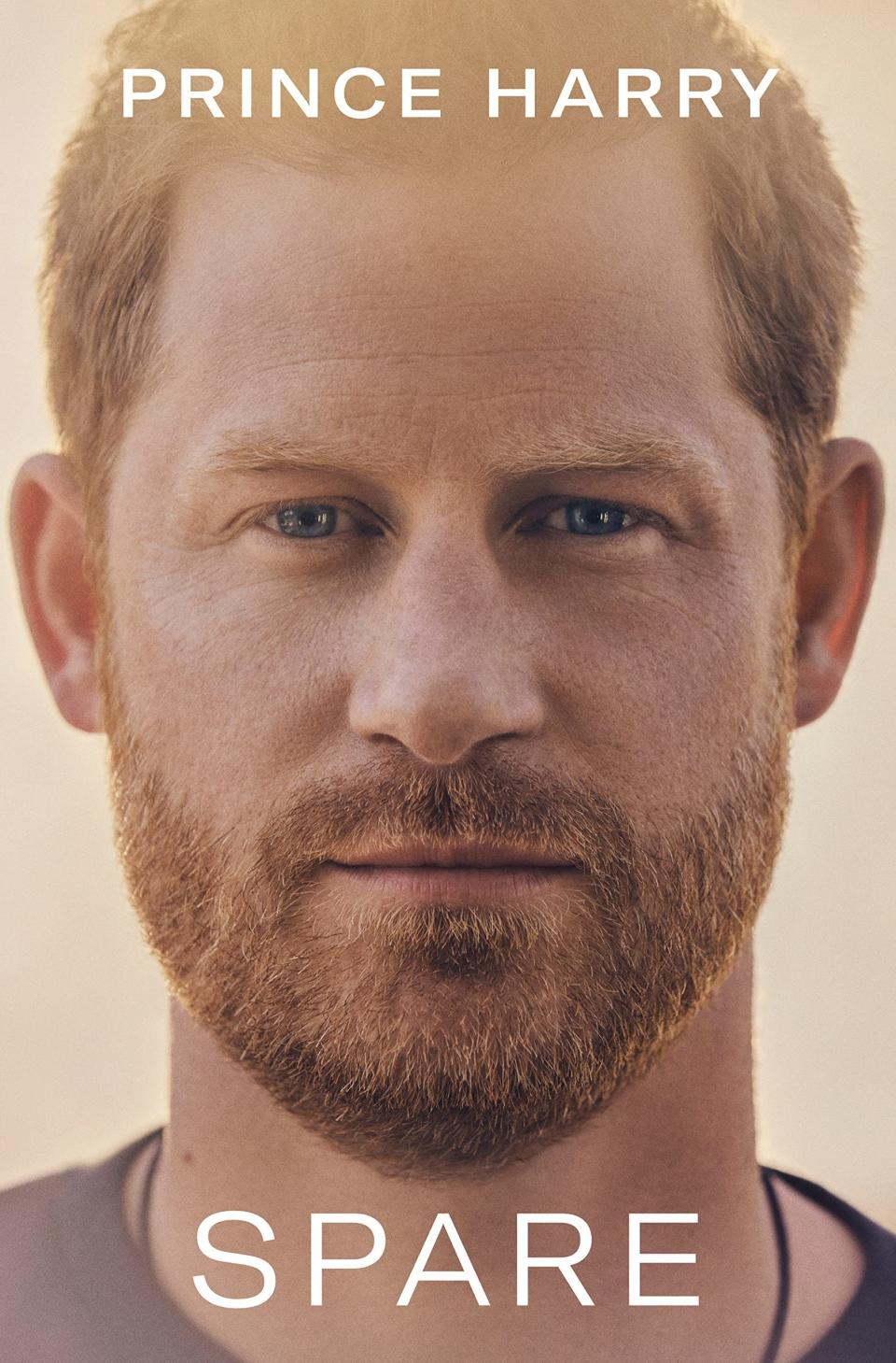 The cover of the book which is a close-up of Prince Harry's face