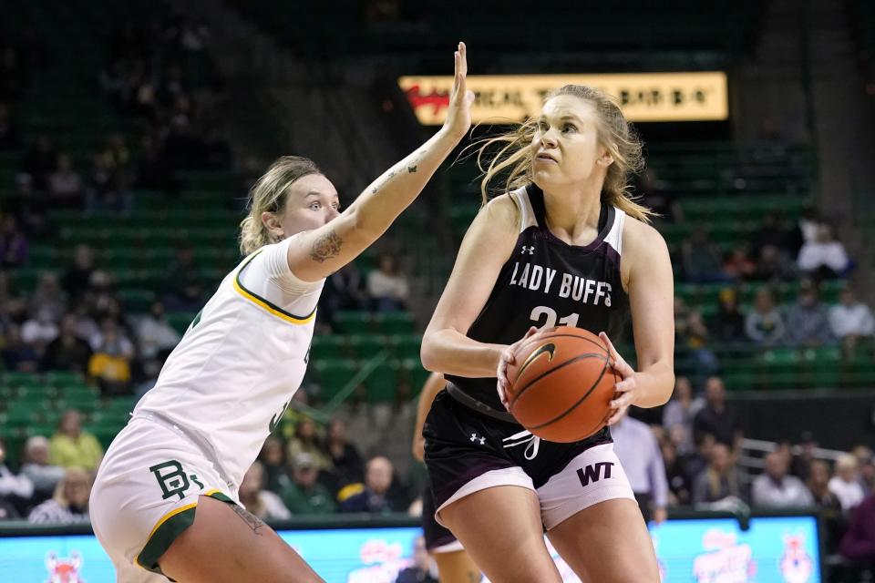 Baylor forward Caitlin Bickel (51) defends as West Texas A&M forward Alivia Lewis (21) positions for a shot in the first half of an exhibition NCAA college basketball game in Waco, Texas, Wednesday, Nov. 3, 2021. (AP Photo/Tony Gutierrez)