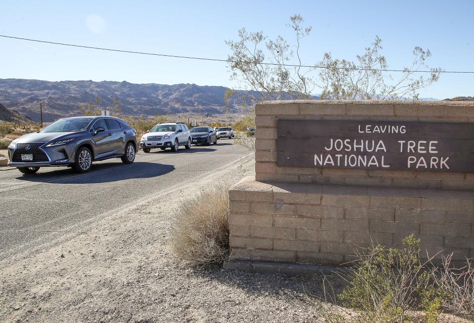 A line of cars waits to get into Joshua Tree National Park, Calif., Monday, January 24, 2022.