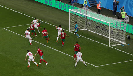 Soccer Football - World Cup - Group B - Morocco vs Iran - Saint Petersburg Stadium, Saint Petersburg, Russia - June 15, 2018 Morocco's Aziz Bouhaddouz scores an own goal and the first goal for Iran REUTERS/Lee Smith