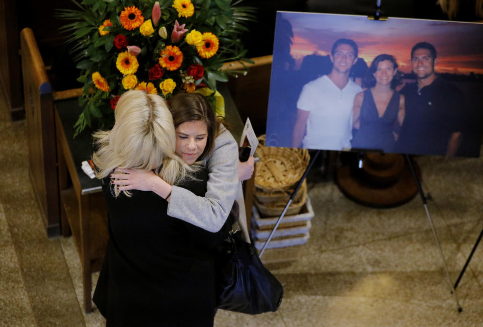 Friends and family arrive for a funeral mass for Pete Frates at St. Ignatius Church in Chestnut Hill, Mass. on Friday, Dec. 13, 2019. Frates, a former college baseball player whose determined battle with Lou Gehrig's disease helped inspire the ALS ice bucket challenge that has raised more than $200 million worldwide. (Craig F. Walker/The Boston Globe via AP, Pool)