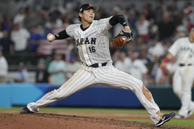 Japan pitcher Shohei Ohtani (16) aims a pitch during the ninth inning of a World Baseball Classic final game against the U.S., Tuesday, March 21, 2023, in Miami. Japan defeated the U.S. 3-2. (AP Photo/Marta Lavandier)