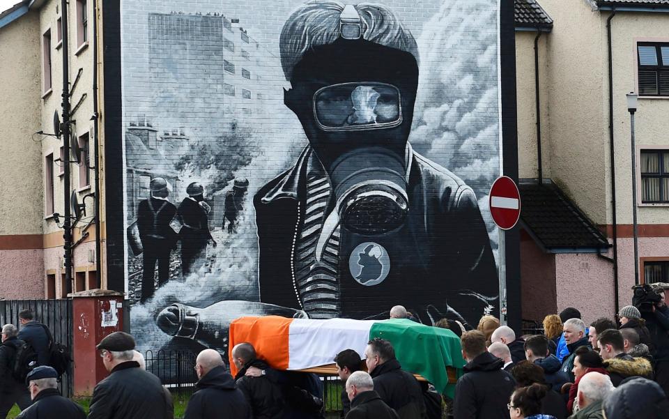 Pall bearers carry the coffin of Martin McGuinness through the streets of Londonderry, Northern Ireland - Credit: CLODAGH KILCOYNE /REUTERS 