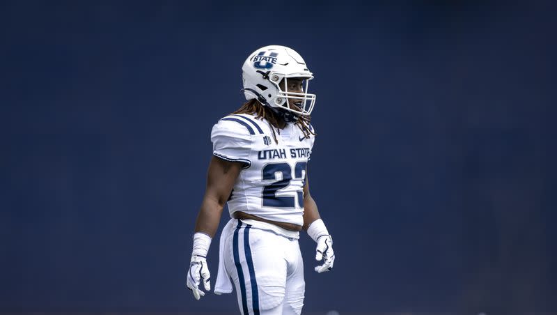 Utah State Aggies running back Jordan Wilmore (23) smiles after a play during an NCAA football game on Saturday, Aug. 27, 2022 in Logan, Utah. Wilmore says he is transferring.