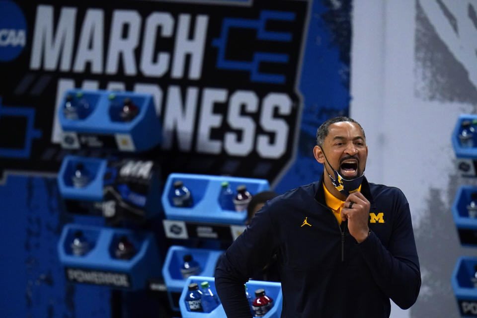 Michigan head coach Juwan Howard directs his team during the first half of a Sweet 16 game against Florida State in the NCAA men's college basketball tournament at Bankers Life Fieldhouse, Sunday, March 28, 2021, in Indianapolis. (AP Photo/Jeff Roberson)