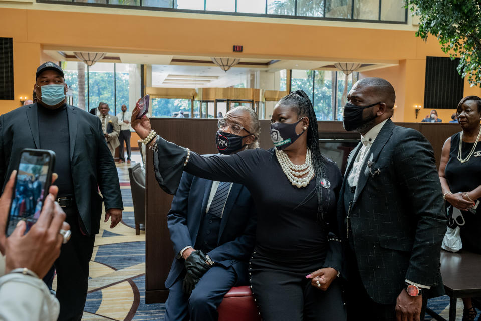 Rev. Al Sharpton takes a photograph with Sybrina Fulton and Pastor Jamal H Bryant before George Floyd's funeral on June 9, 2020.<span class="copyright">Ruddy Roye for TIME</span>