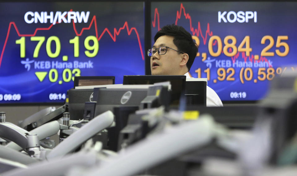 A currency trader works at the foreign exchange dealing room of the KEB Hana Bank headquarters in Seoul, South Korea, Monday, June 10, 2019. Asian financial markets advanced on Monday after China released better-than-expected trade data for May. Gains were reined in by worries over where the world’s two largest economies stood on trade negotiations. (AP Photo/Ahn Young-joon)