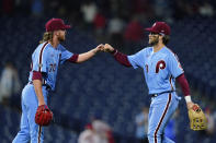 Philadelphia Phillies' Bryce Harper, right, and Bailey Falter celebrate after a baseball game against the Pittsburgh Pirates, Thursday, Sept. 23, 2021, in Philadelphia. (AP Photo/Matt Slocum)