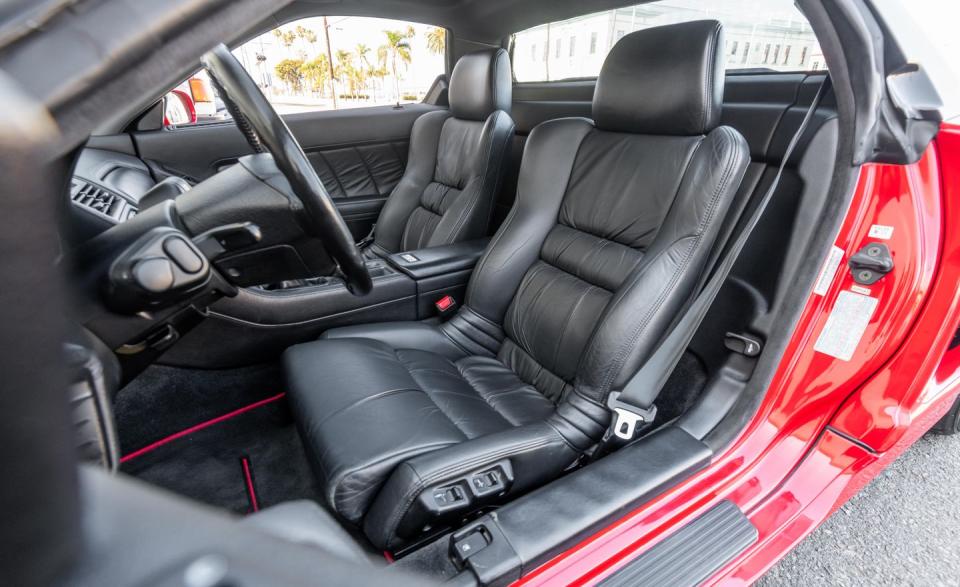 <p>At first, the Acura's seating position feels odd. You sit tall within its cabin and look out through the top third of its huge windshield over an impossibly low cowl.</p>