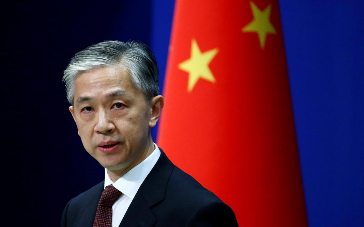 Chinese Foreign Ministry spokesman Wang Wenbin speaks during a news conference in Beijing - REUTERS