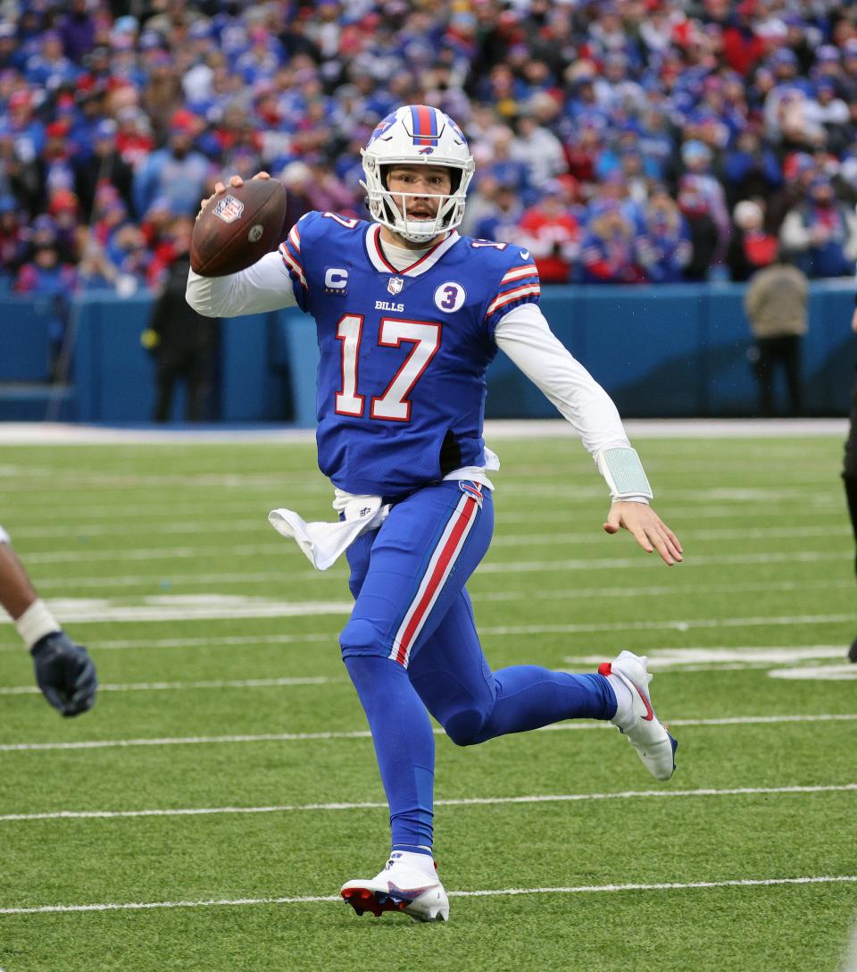 Bills quarterback Josh Allen heads for the sideline after escaping pressure. 