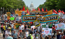 Demonstrators march down Pennsylvania Avenue during a People's Climate March, to protest U.S. President Donald Trump stance on the environment, in Washington, U.S., April 29, 2017. REUTERS/Mike Theiler