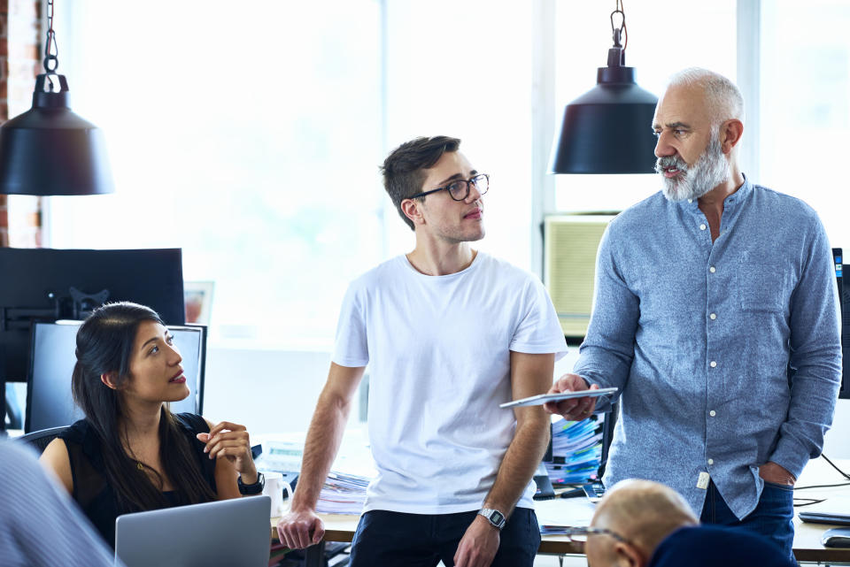 Team of creative people having meeting modern office