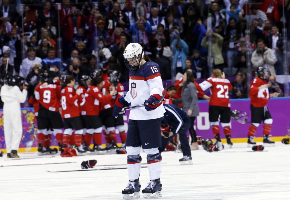 Anne Schleper of the United States (15) skates back to the bench after Canada scored in overtime to win the women's gold medal ice hockey game 3-2 at the 2014 Winter Olympics, Thursday, Feb. 20, 2014, in Sochi, Russia. (AP Photo/Matt Slocum)