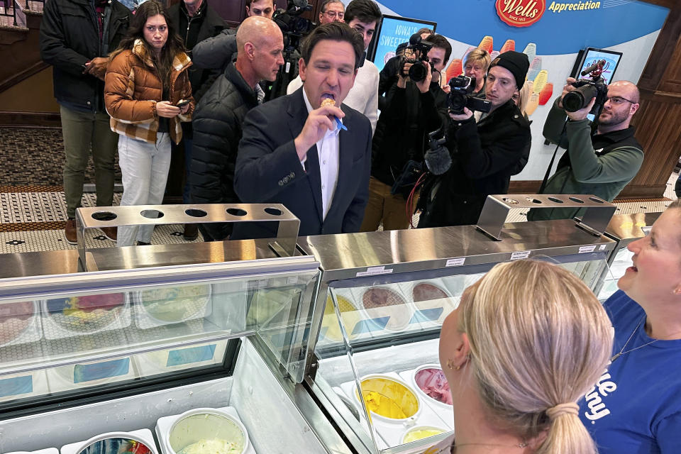 Florida Gov. Ron DeSantis samples praline pecan before ordering a cone at the Blue Bunny Ice Cream Parlor in LeMars, Iowa, Thursday, Jan. 11, 2024. The parlor is a common stop for Republicans when campaigning in northwest Iowa, where social conservatives carry outsize influence in Iowa's Republican caucuses and where DeSantis and Trump are competing aggressively for evangelical conservatives. (AP Photo/Thomas Beaumont)
